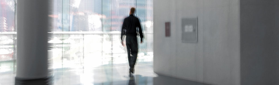 Man walking down corridor